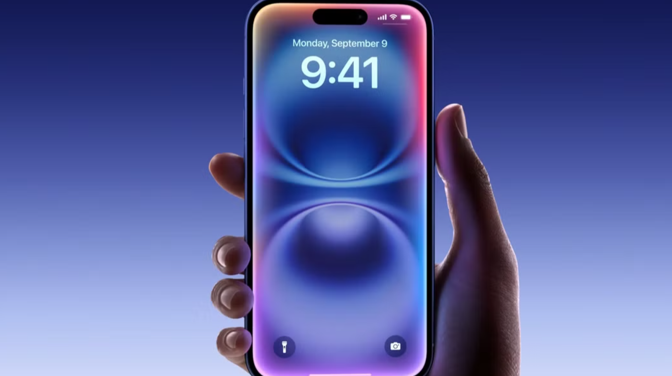 an-iphone-16-in-hand-with-a-blue-gradient-background.jpg?q=70&fit=crop&w=1100&h=618&dpr=1