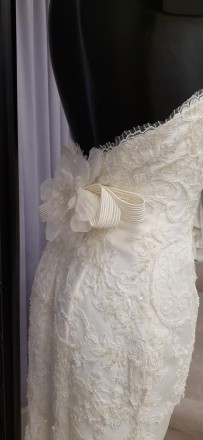 Свадебное платье с кружевом вышивкой бисером
Приталенный силуэт, декоративный ба. . фото 3