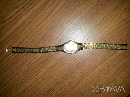 Часы женские с позолоченным браслетом механика.. . фото 1