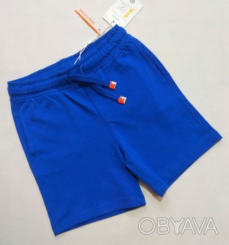 Синие однотонные шорты от итальянского бренда Fagottino для мальчика в размере 9. . фото 1