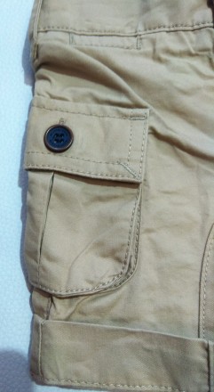 Песочные однотонные шорты от английского бренда Mothercare для мальчика в размер. . фото 4