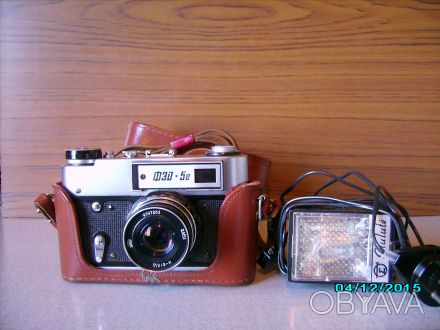 Продаётся фотоаппарат ФЭД 5в+вспышка,в родном кожаном футляре,состояние полность. . фото 1