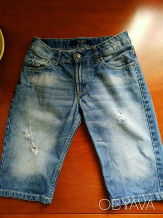 Стильные качественные джинсовые Капри на мальчика 9-10лет,в состоянии новых.Джин. . фото 1