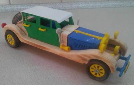 Данная модель игрушки сделана из дерева и ABS пластика, колеса, которые  крутятс. . фото 2