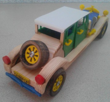 Данная модель игрушки сделана из дерева и ABS пластика, колеса, которые  крутятс. . фото 3
