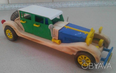 Данная модель игрушки сделана из дерева и ABS пластика, колеса, которые  крутятс. . фото 1