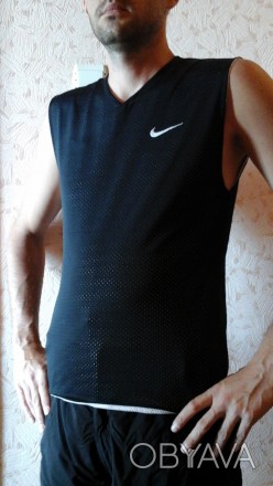 Двостороння майка Nike - ідеальний варіант для занять будь-яким видом спорту (бі. . фото 1