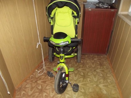 Продам детский трехколесный велосипед с надувными колесами,с ручкой,козырьком,по. . фото 4