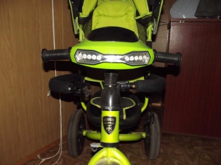 Продам детский трехколесный велосипед с надувными колесами,с ручкой,козырьком,по. . фото 3