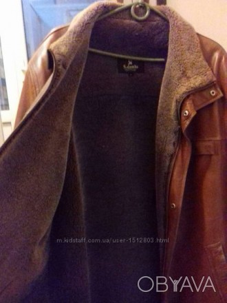 Продам коричневую кожаную курточку в середине натуральный мех ,очень теплая.. . фото 1