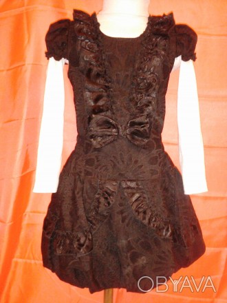 Необычное платье с коротким рукавчиком-фонарик, черного цвета прекрасно будет см. . фото 1
