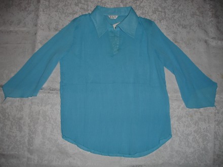 Блузка 44-46 р., нова, плісерована, ніжно-голуба.
Вказаний розмір L/XL, але це . . фото 2