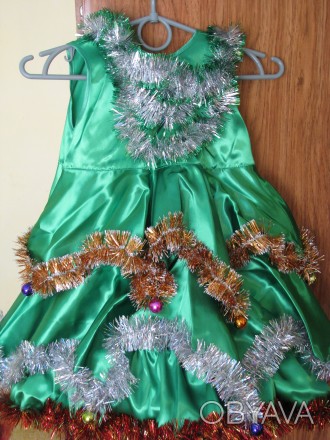 Карнавальный новогодний костюм ёлочки

Платье смотрится шикарно, очень пышное.. . фото 1