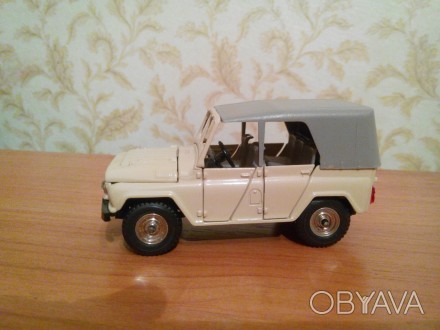 Модель автомобиля " УАЗ - 469" в масштабе 1:43.
Модель автомобиля подлинная в р. . фото 1