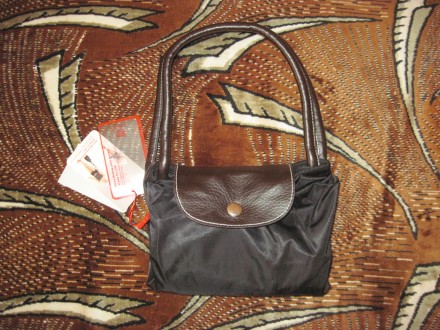 Новая с этикеткой - очень удобная и компактная раскладная сумочка, черного цвета. . фото 4
