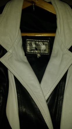 Продам женскую кожаную куртку, доина - до талии, черного цвета с белыми вставкам. . фото 7