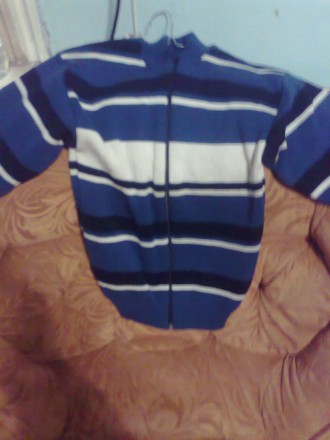 Продам зимнюю куртку (пуховик) размер S, болотного цвета на мальчишку возрастом . . фото 8