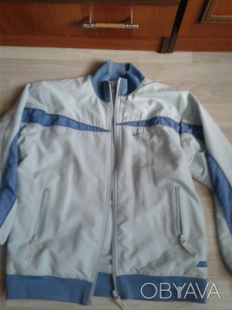 Куртка спортивного стилю плащова тканина на сіточній підкладці голубого кольору . . фото 1
