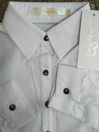 Красивые и качественные   белые блузки   для девочек фирмы DELORAS.
Состав : 76. . фото 5
