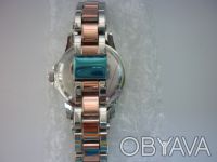 Продам новые женские наручные часы двухцветные,серебряно-золотистого цвета.Диаме. . фото 3