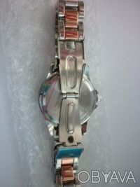 Продам новые женские наручные часы двухцветные,серебряно-золотистого цвета.Диаме. . фото 5