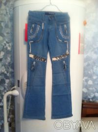 Модные голубые джинсы с красивой отделкой . 

Размерный ряд: 25, 28, 29, 30.
. . фото 3