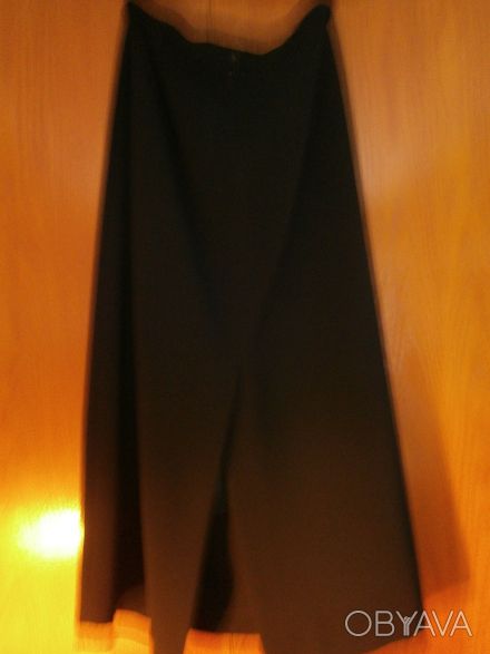 Продам черную удлиненную юбку-макси на черной шелковой подкладке. Шлица сзади пр. . фото 1