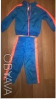 Детские спорт.костюмы:
1.утепленный, марка polo,синего цвета с черно-белыми пол. . фото 4