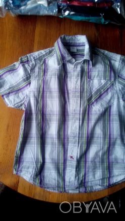 Рубашка (тенниска) с коротким рукавом, фирменная
на рост 140 см, новая, цена 10. . фото 1