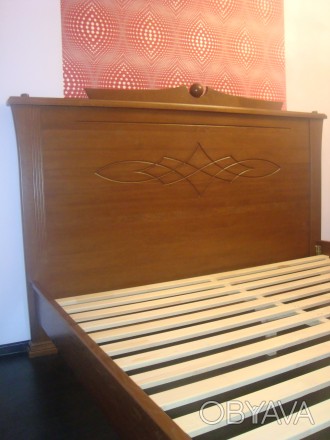 двухспальная кровать из массива ольхи,вставка в спинках мдф ротанг
р-р 2000*160. . фото 1