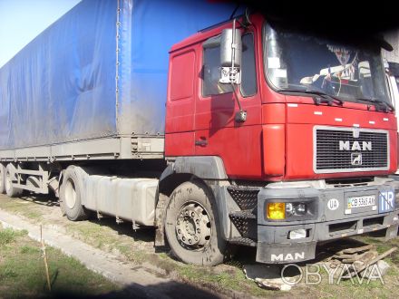 Продам ( возможен обмен) грузовую машину
ман с полуприцепом(22т). 
 Машина б/у. . фото 1
