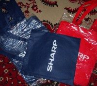 сумка-мешок на плечо
Черного и красного цветов
С тканного материала. . фото 2