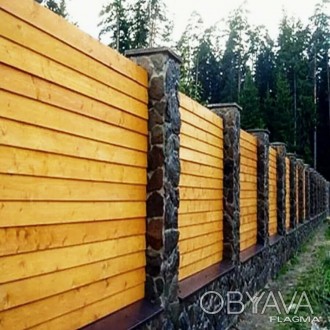 Деревянные заборы и входные ворота отличаются надежностью, простотой и функциона. . фото 1