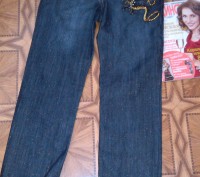 Новые джинсы,ОТ до 75см,бедра до 92см, одна маленькая проблемка нет пуговицы - н. . фото 3