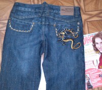 Новые джинсы,ОТ до 75см,бедра до 92см, одна маленькая проблемка нет пуговицы - н. . фото 2