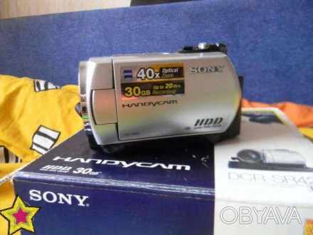 Стильная и компактная видеокамера HDD Handycam® с жестким диском емкостью 30 ГБ . . фото 1