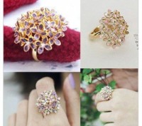 Новое золотистое кольцо с фиолетовыми цветами и камнями
Диаметр 3,3см
Смотрите. . фото 2