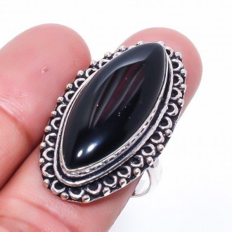 Предлагаем Вам купить красивое кольцо из камня черный оникс.
Размер 18,2.
индийс. . фото 2