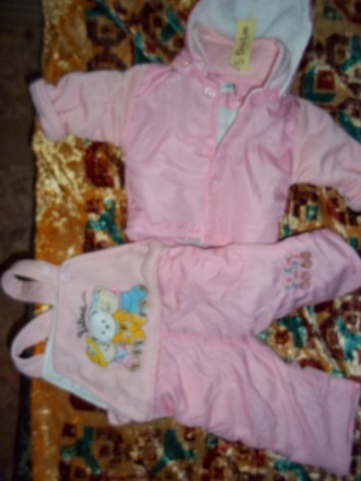 продам новый (с этикеткой) розовый  костюм на новорожденную девочку, длина куртк. . фото 2