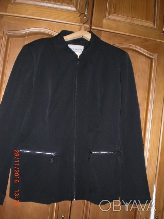 Піджачок чорний може бути курточка. Розмір - 50.
Виробник - Італія
62% акріл, . . фото 1