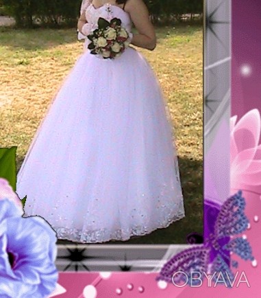 Продам невенчаное свадебное платье белого цвета. Платье розмера 46-48, пишное с . . фото 1