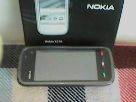 Продам под ремонт, мобильный телефон Nokia 5230,с двумя зарядными устройствами с. . фото 4