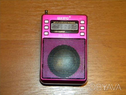 Продам  радіоприймач який в собі вміщує MP3 плеєр, ліхтарик, гніздо для мікро SD. . фото 1