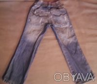 джинсы почти новые ,синие ,узкие   с эффектом потертости и драными коленями, про. . фото 7