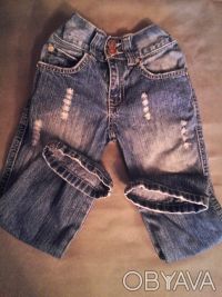 джинсы почти новые ,синие ,узкие   с эффектом потертости и драными коленями, про. . фото 6