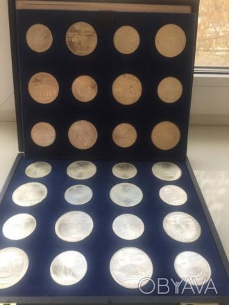 Набор монет в футляре "Олимпиада Монреаль 1976 г." 14 штук - номинал 5$, 14 штук. . фото 1
