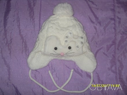 Продам дитячу зимову шапочку (для дівчинки 2-5 р.) в ідеальному стані. На фото н. . фото 1