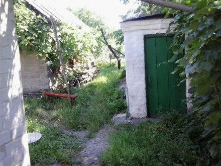 Продам дом на ул.Ткаченко, р-н Загребля,кирп.,на 2 входа, отопление печное и газ. . фото 4