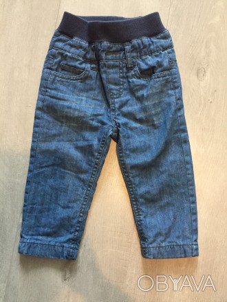 Продам новые фирменные джинсы на мальчика 9-12 мес.Рост 74 см.Покупали в Швейцар. . фото 1