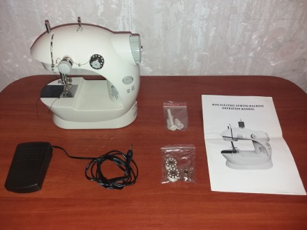 Продам портативную швейную машинку портативная Mini Sewing Machine SM-202A.

M. . фото 2